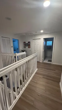 a bedroom with a bed and a view of en suite bathroom