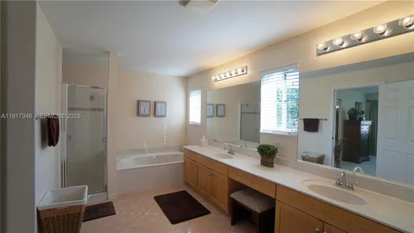 a bedroom with a bed and a ceiling fan
