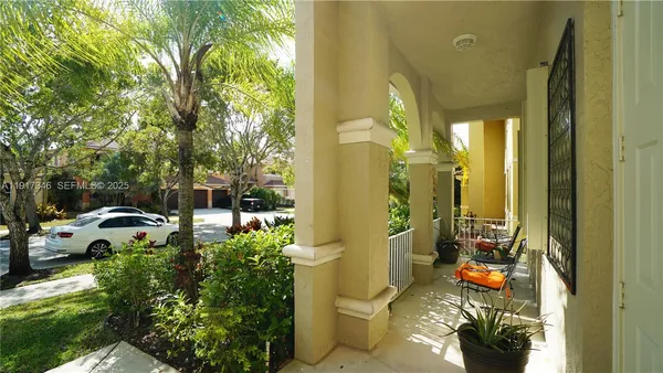 a lobby with furniture and a rug