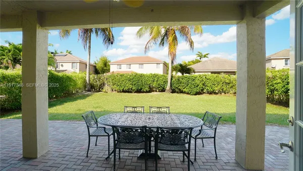 a view of swimming pool with a patio