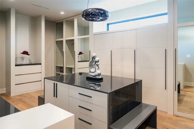 a kitchen with a refrigerator and a stove