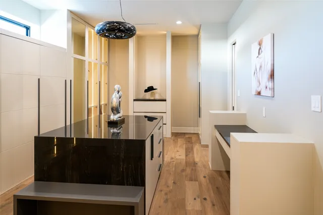 a kitchen with a refrigerator and a sink