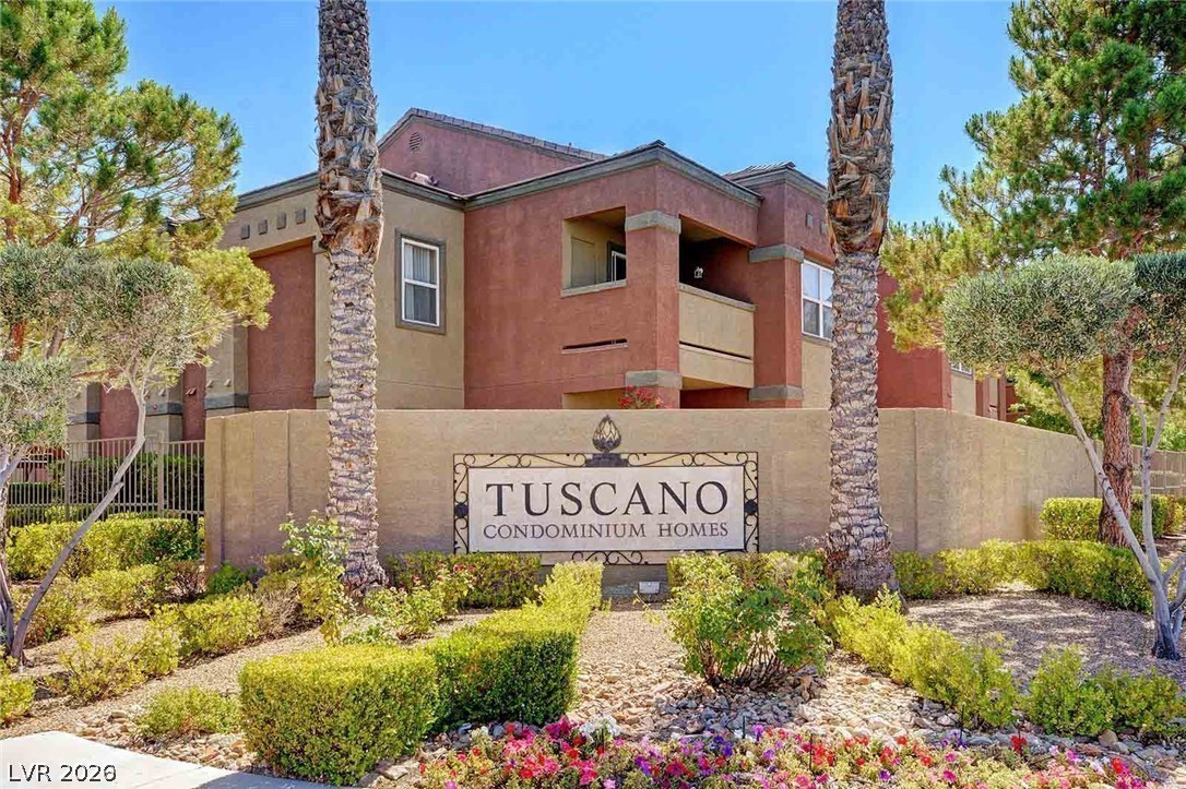 7255 West Sunset Road, Unit 2078 Las Vegas, NV 89113 - Photo 21 of 34 The welcoming entrance to Tuscano Condominium Homes is framed by manicured landscaping and tall palm trees.