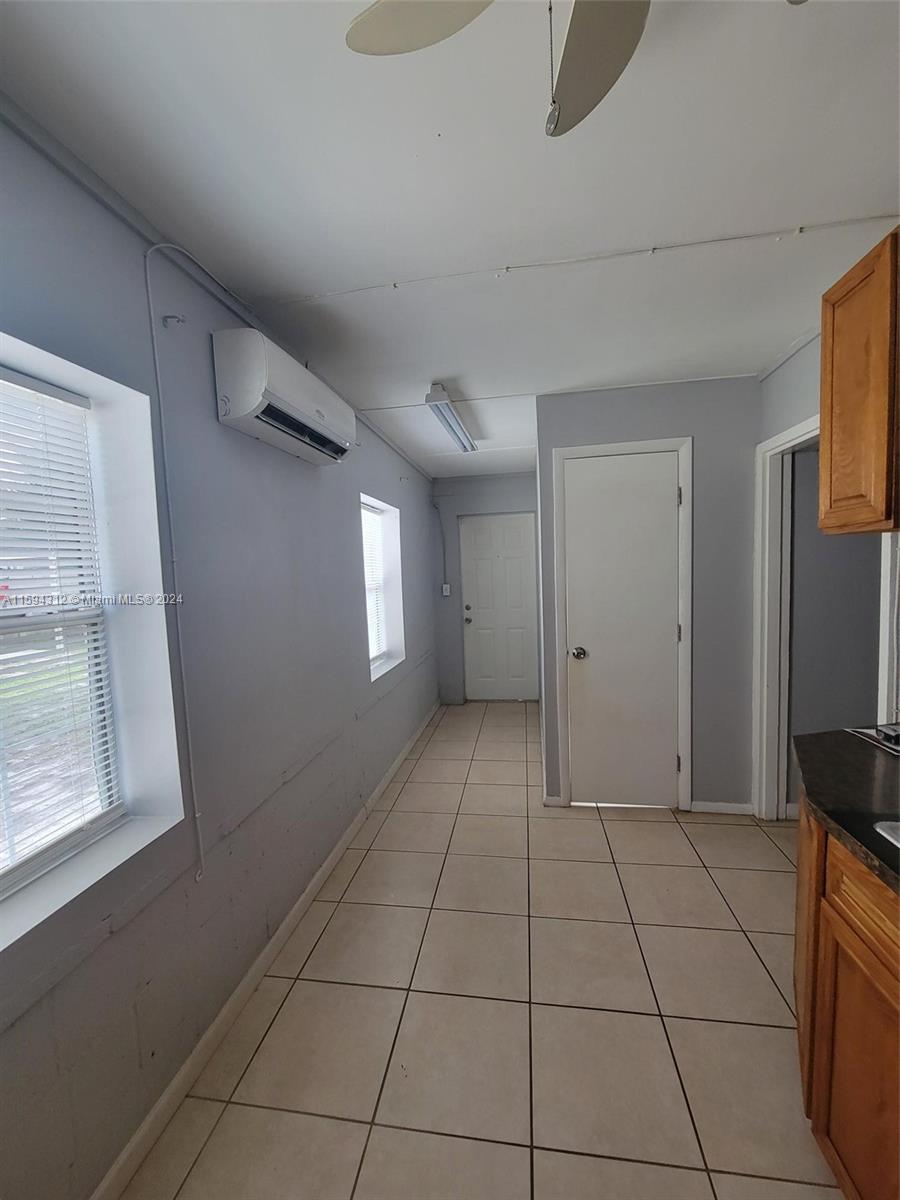 1107 Mayflower Road Fort Pierce, FL 34950 - Photo 12 of 21 a view of an empty room with a window