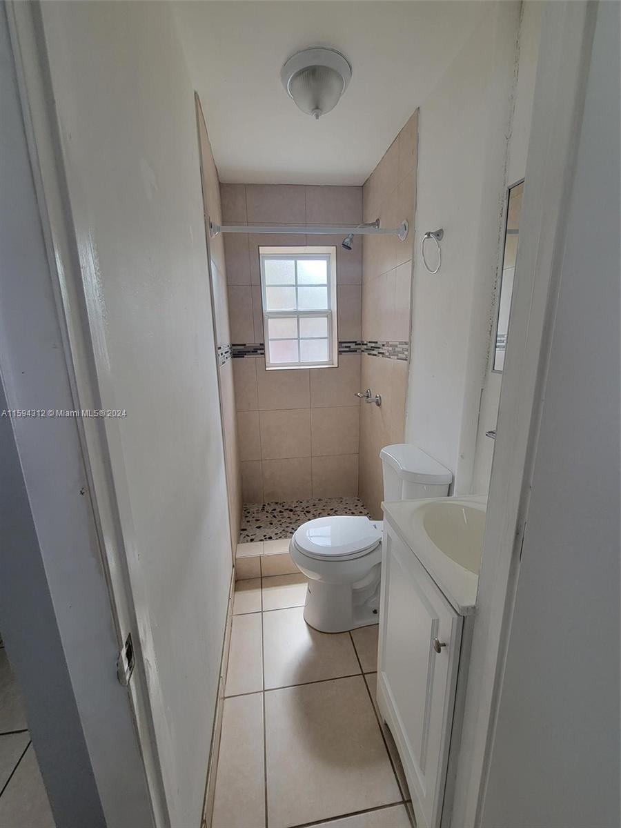 1107 Mayflower Road Fort Pierce, FL 34950 - Photo 13 of 21 a bathroom with a toilet and a shower