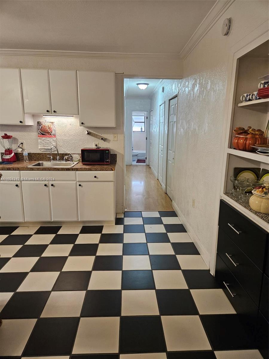 1107 Mayflower Road Fort Pierce, FL 34950 - Photo 14 of 21 a black and white checkered floor
