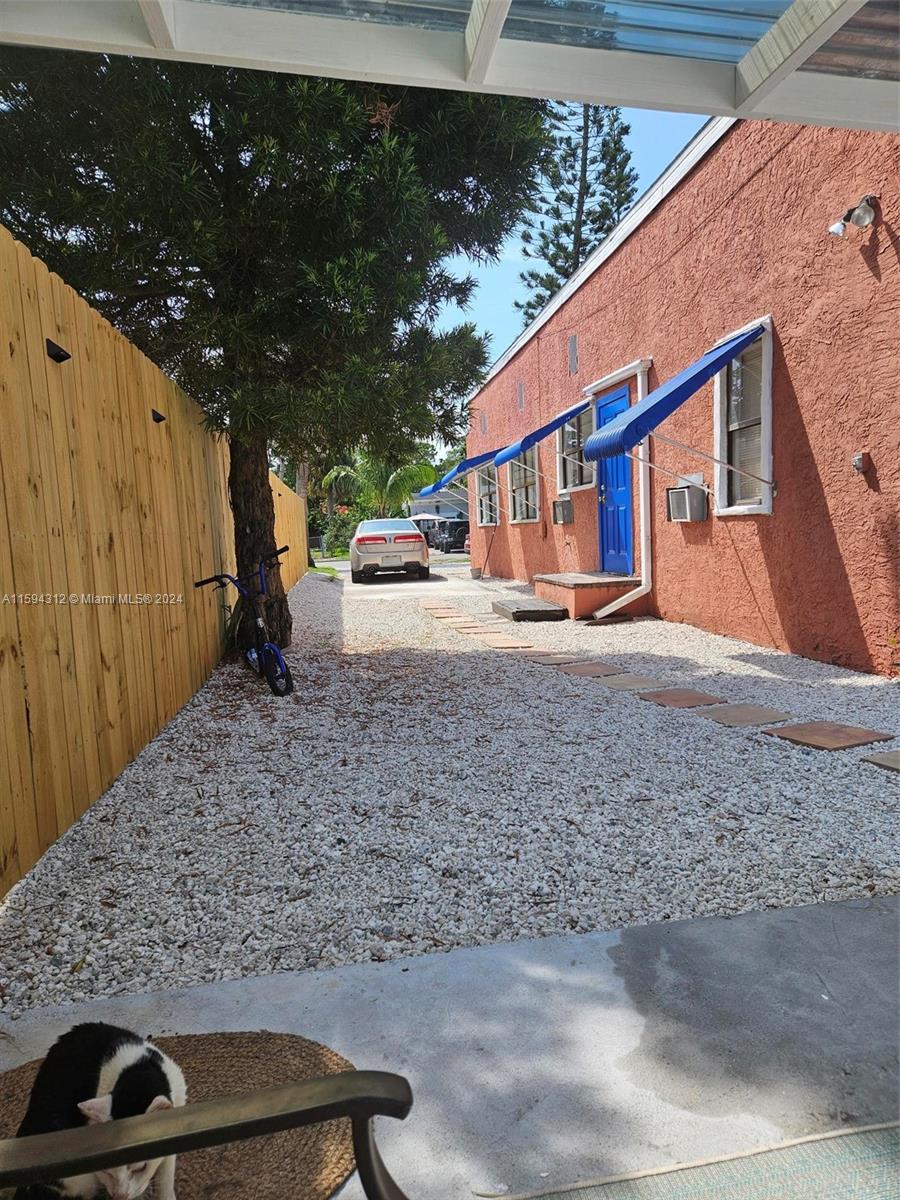 1107 Mayflower Road Fort Pierce, FL 34950 - Photo 6 of 21 a backyard of a house with a yard