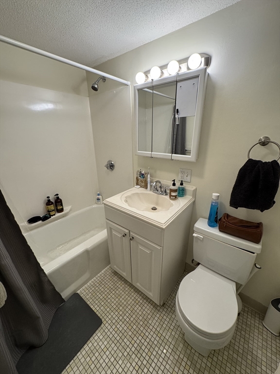 49 Marion Street, Unit 4D Brookline, MA 02446 - Photo 8 of 8 a bathroom with a sink toilet and shower