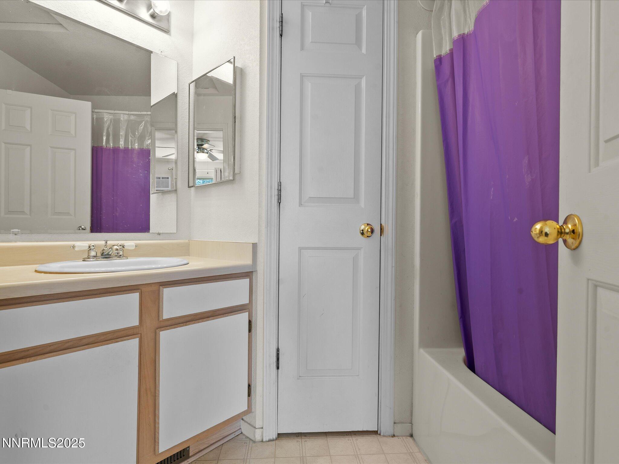 397 Nader Way Fernley, NV 89408 - Photo 23 of 27 a bathroom with a sink and a mirror