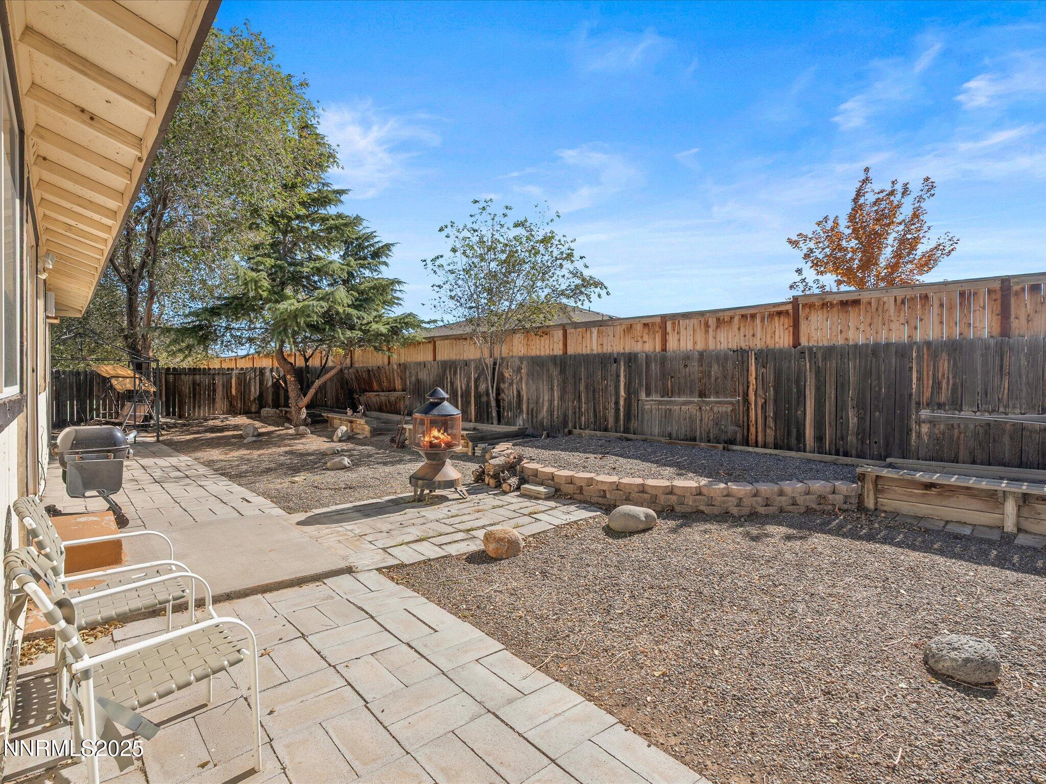 397 Nader Way Fernley, NV 89408 - Photo 25 of 27 a view of backyard with a table and chairs