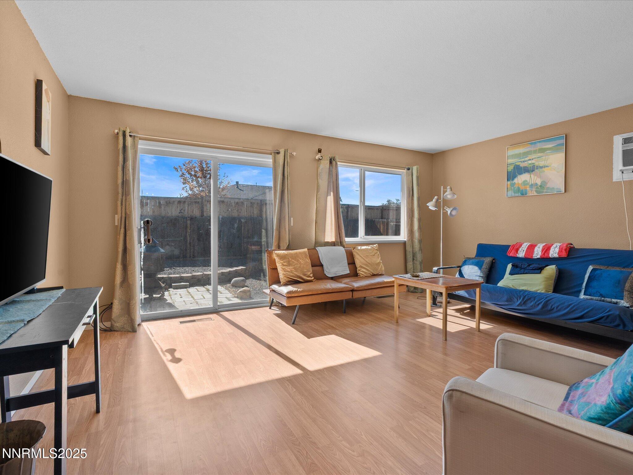 397 Nader Way Fernley, NV 89408 - Photo 7 of 27 a living room with furniture and a flat screen tv