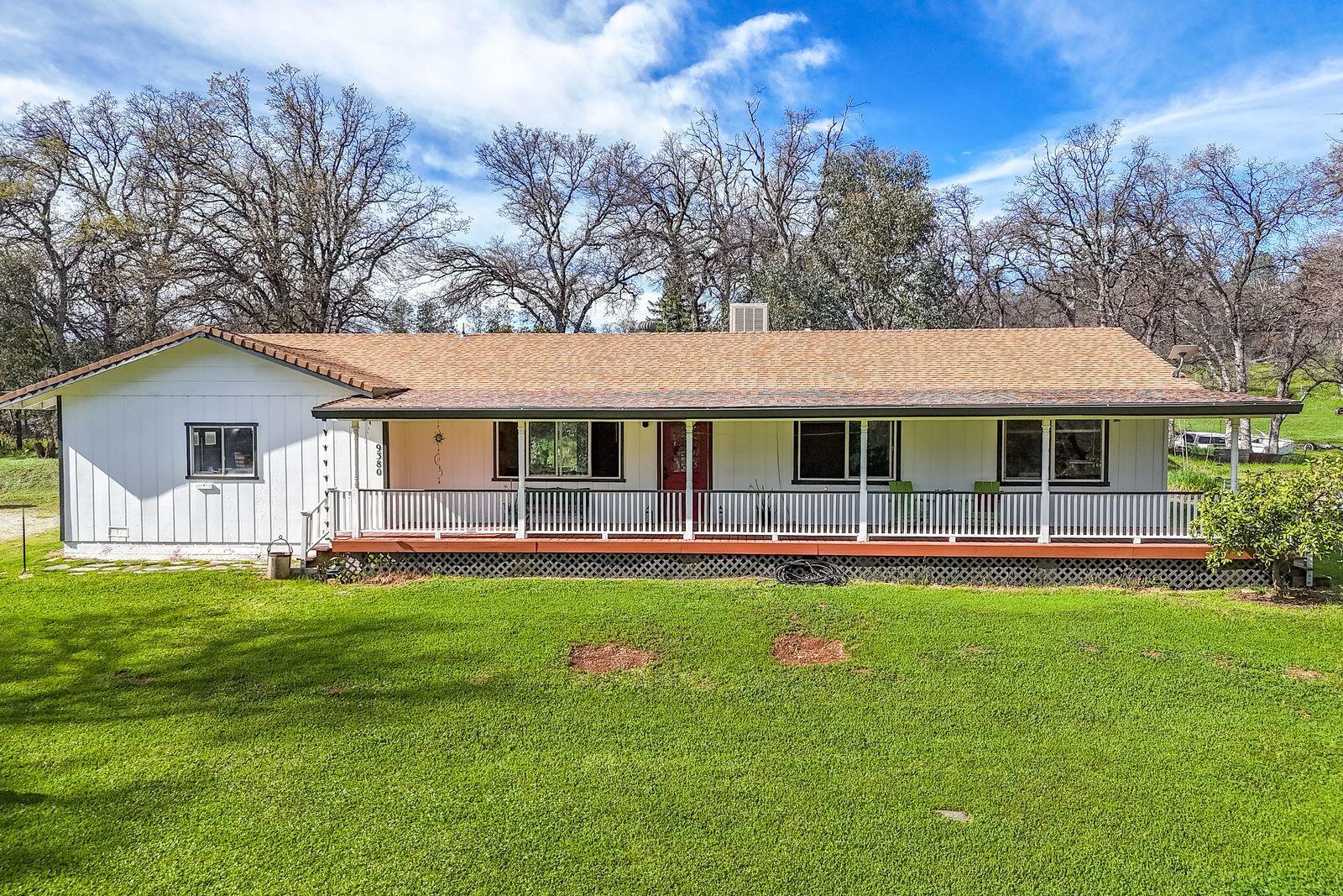 9380 Placer Road Redding, CA 96001 - Photo 1 of 47 a front view of house with yard and green space