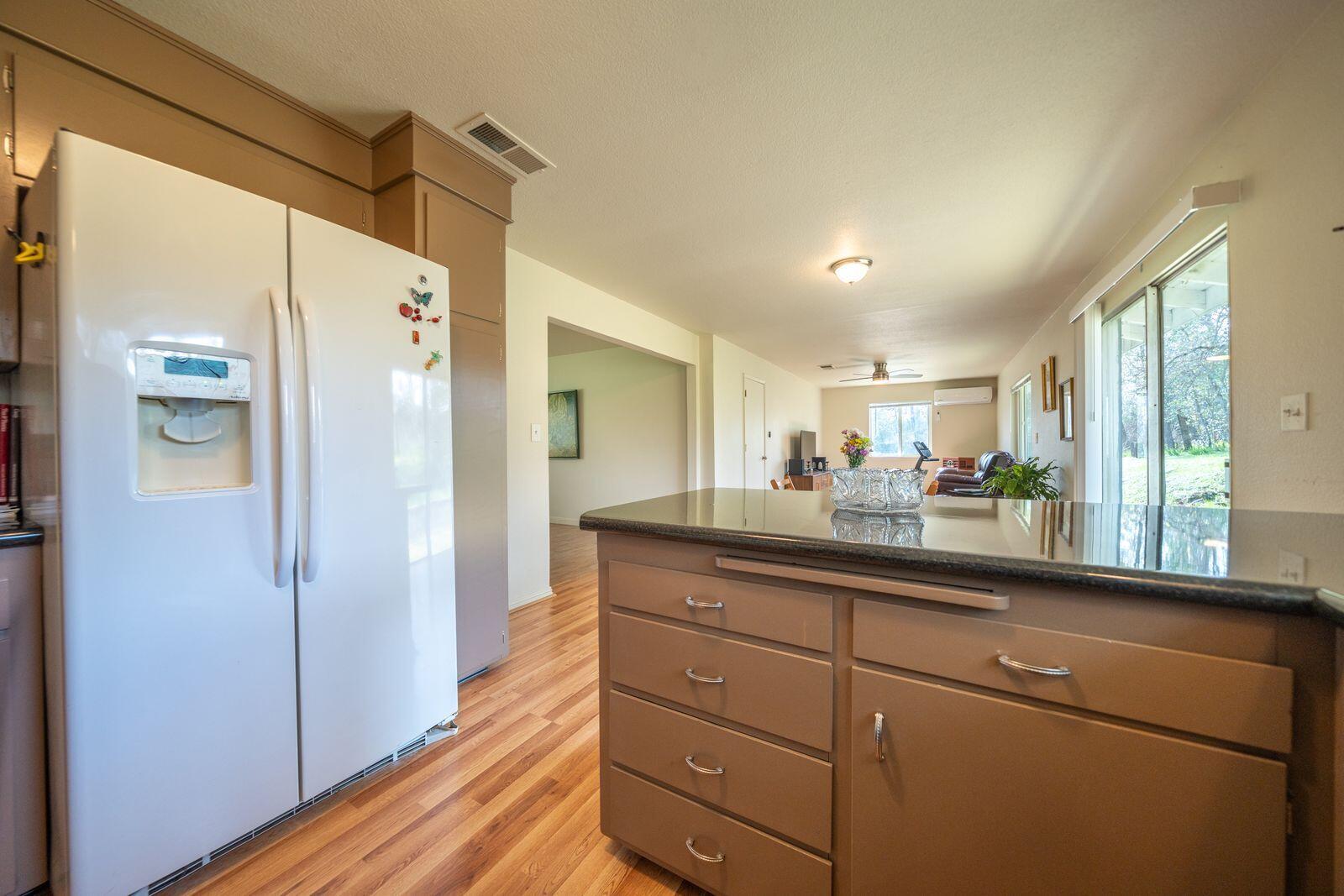 9380 Placer Road Redding, CA 96001 - Photo 12 of 47 a bathroom with a sink a mirror and a shower