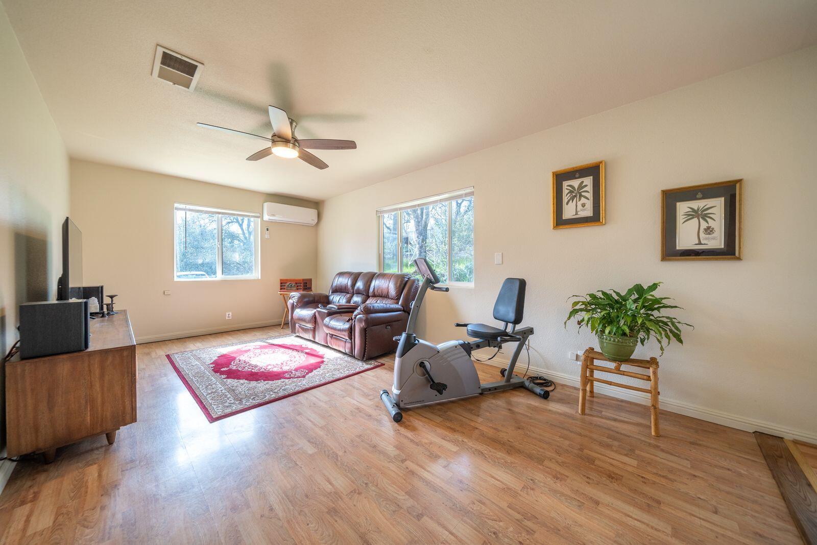 9380 Placer Road Redding, CA 96001 - Photo 19 of 47 a living room with furniture and a wooden floor