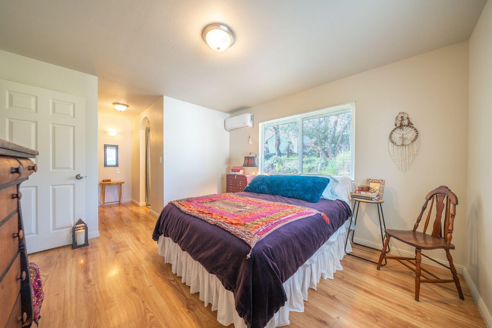 9380 Placer Road Redding, CA 96001 - Photo 21 of 47 a bedroom with a bed and a table in it