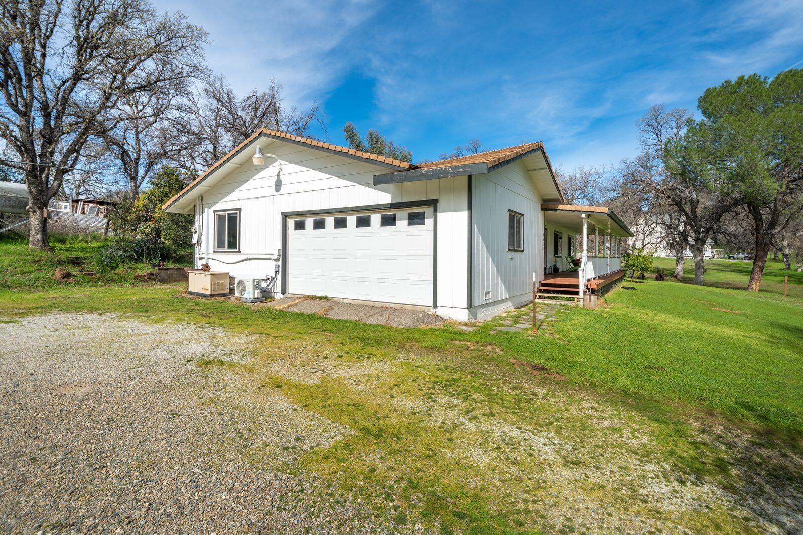 9380 Placer Road Redding, CA 96001 - Photo 35 of 47 a view of a house with a yard