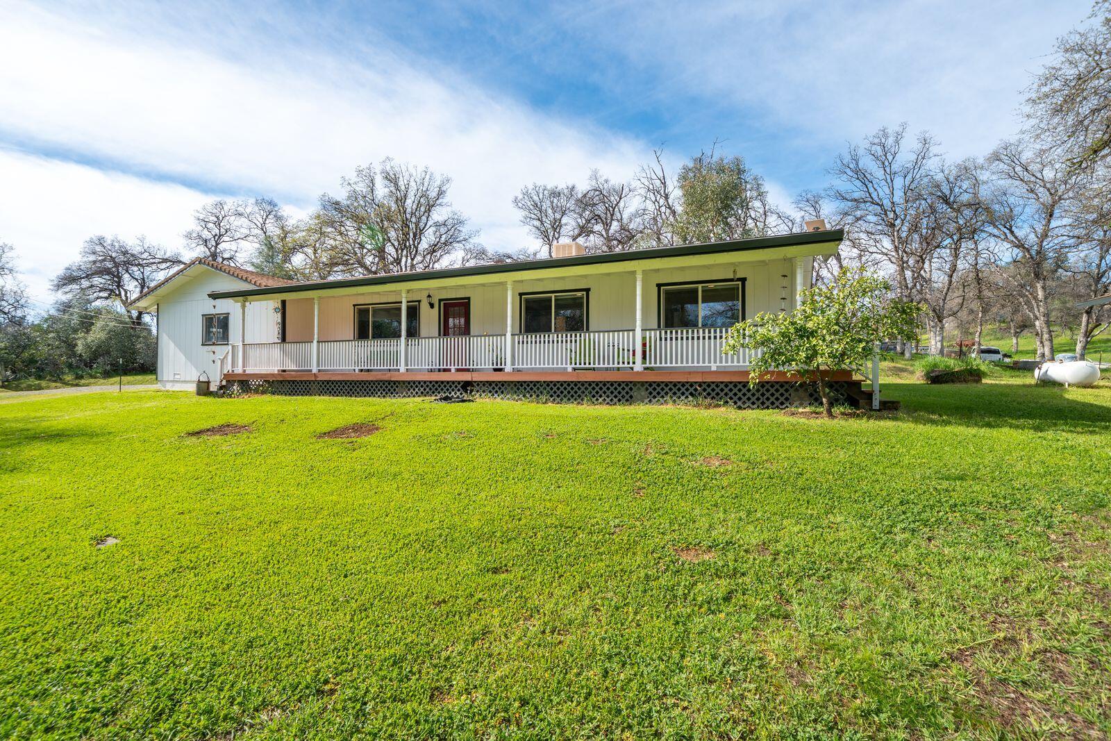 9380 Placer Road Redding, CA 96001 - Photo 36 of 47 a view of a house with a yard
