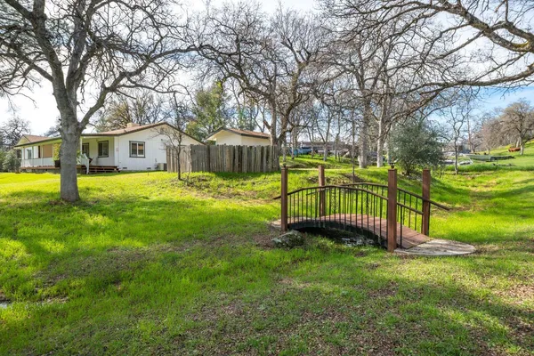 a view of a house with a yard porch and sitting area