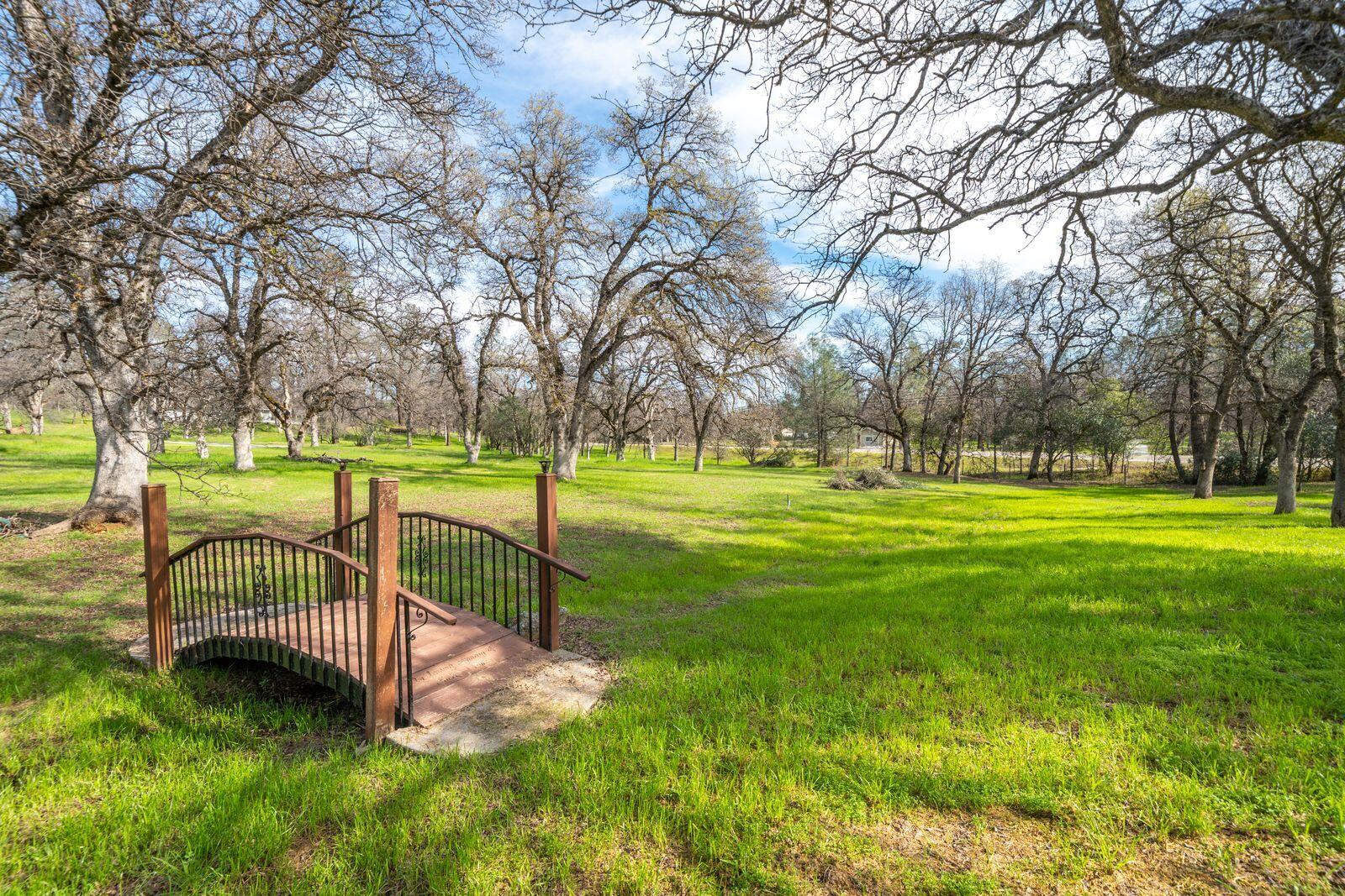 9380 Placer Road Redding, CA 96001 - Photo 41 of 47 a view of a park with swings and a table