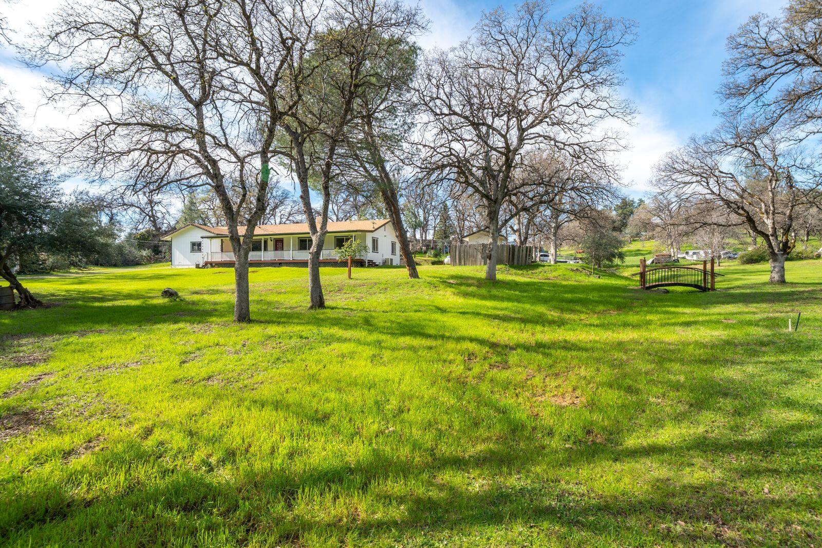 9380 Placer Road Redding, CA 96001 - Photo 43 of 47 a view of a big yard with trees
