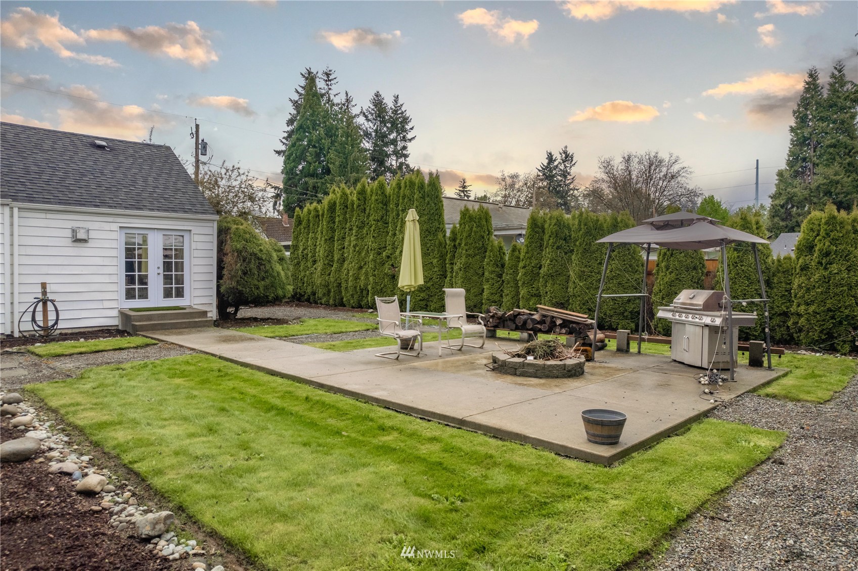 437 State Street Sumner, WA 98390 - Photo 18 of 25 a view of a house with backyard porch and sitting area