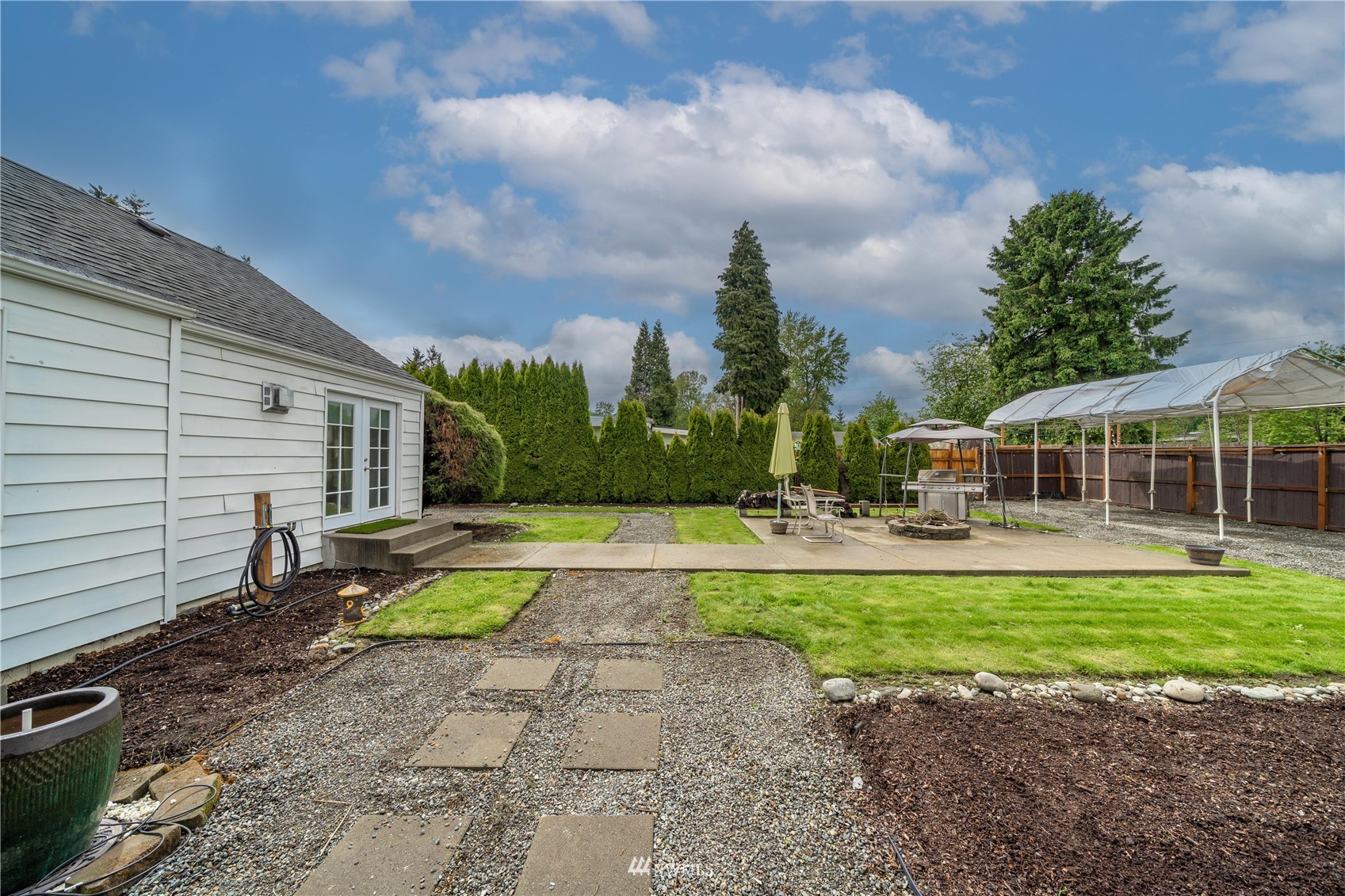 437 State Street Sumner, WA 98390 - Photo 19 of 25 a view of a house with backyard and sitting area