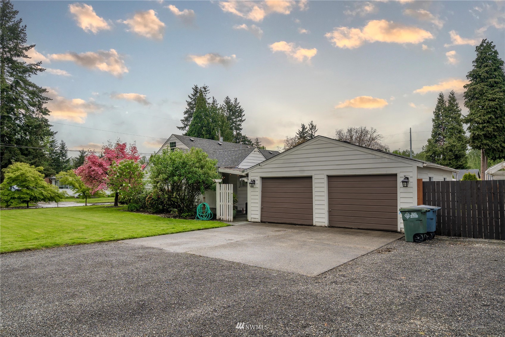 437 State Street Sumner, WA 98390 - Photo 3 of 25 a view of a house with a yard and garage