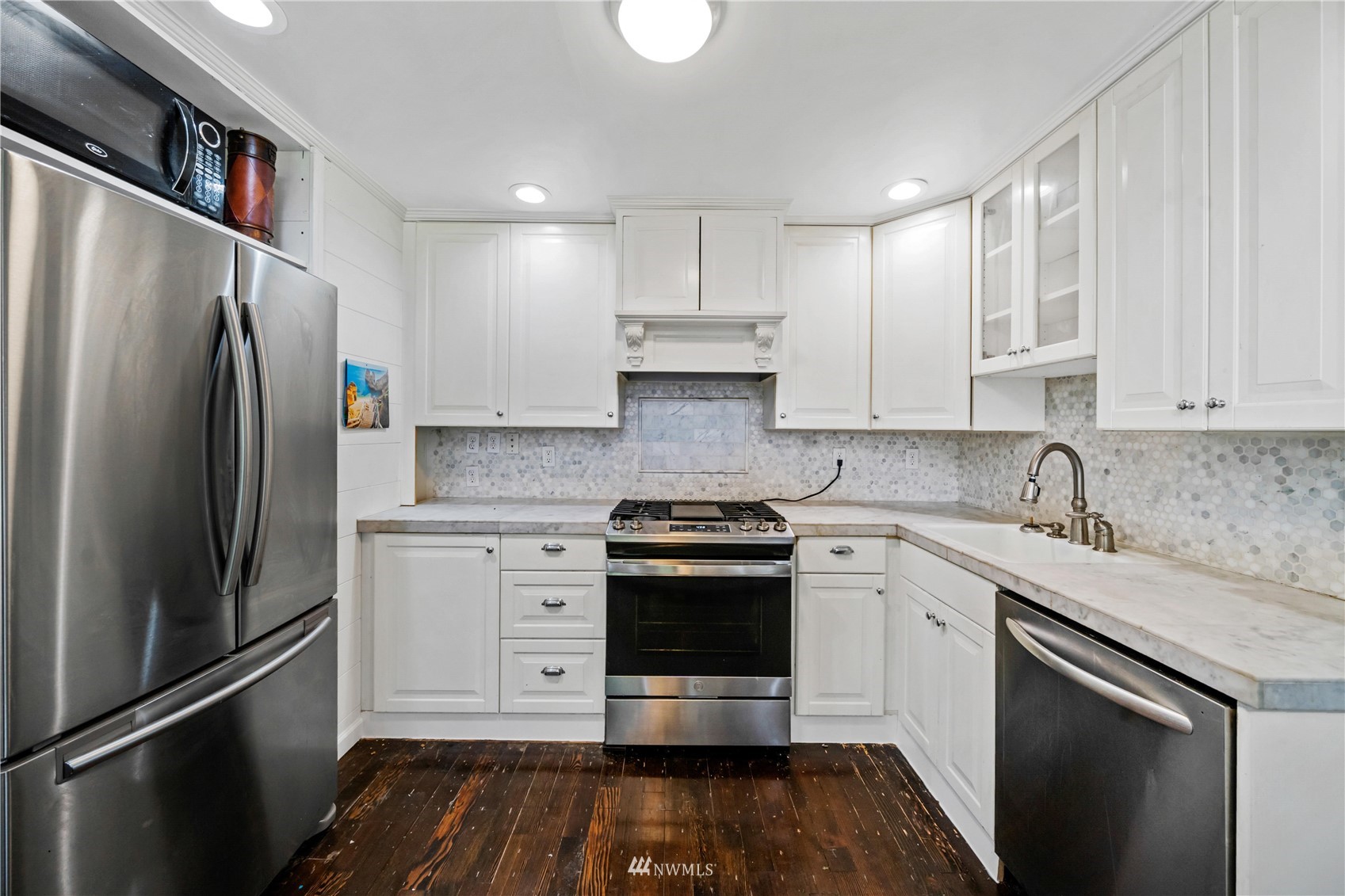 437 State Street Sumner, WA 98390 - Photo 6 of 25 a kitchen with stainless steel appliances granite countertop a stove a refrigerator and a sink