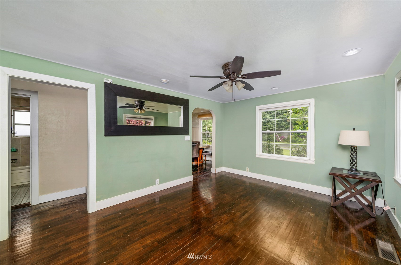 437 State Street Sumner, WA 98390 - Photo 9 of 25 a view of a livingroom with a workspace wooden floor and a window