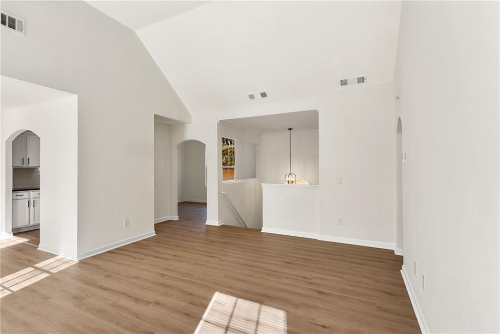 5805 Marbut Road Lithonia, GA 30058 - Photo 15 of 46 a view of a room with wooden floor and bench