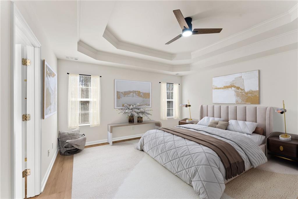 5805 Marbut Road Lithonia, GA 30058 - Photo 21 of 46 a spacious bedroom with a large bed and a chandelier