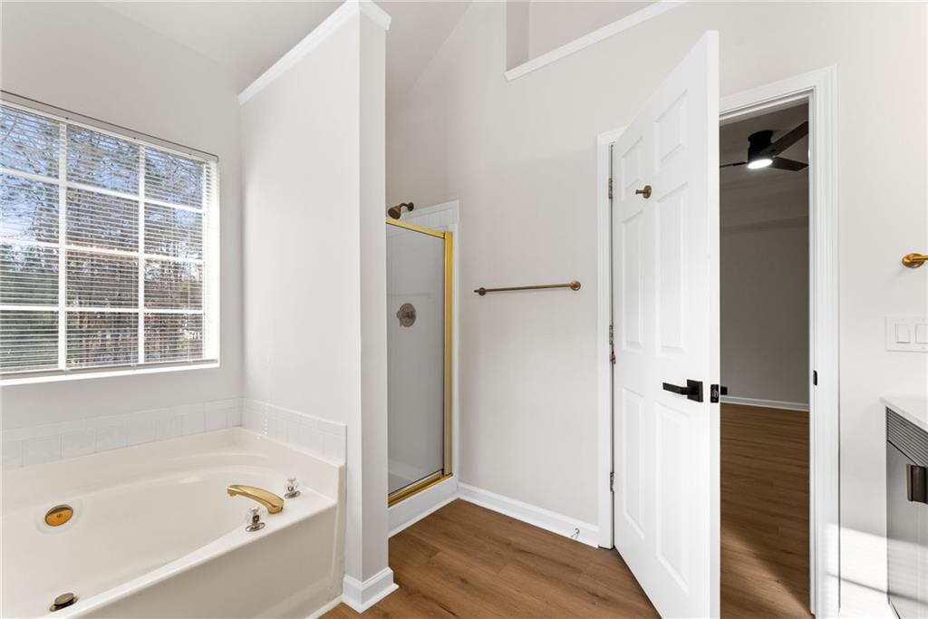 5805 Marbut Road Lithonia, GA 30058 - Photo 26 of 46 a bathroom with a tub shower and a sink