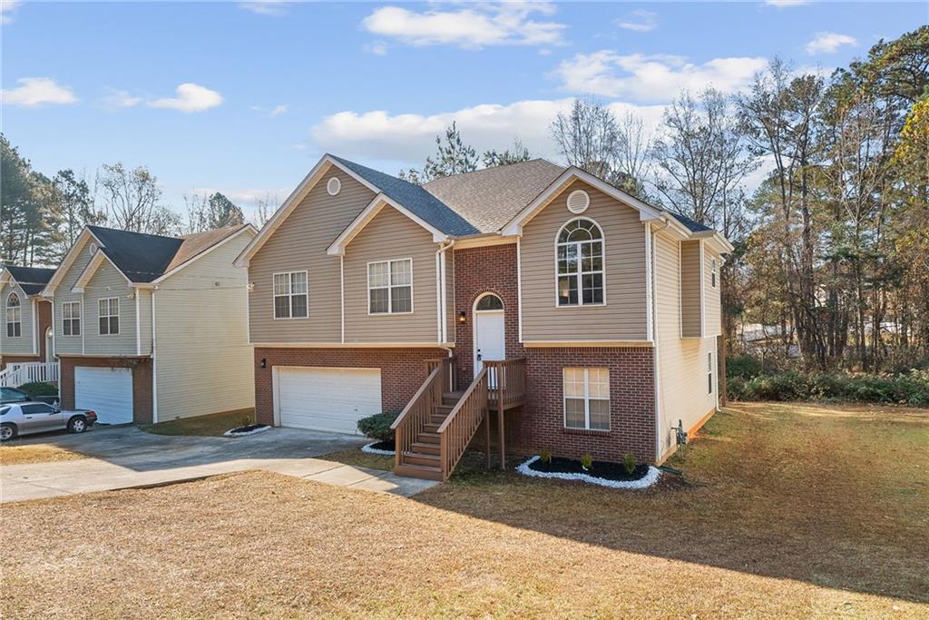 5805 Marbut Road Lithonia, GA 30058 - Photo 3 of 46 a view of a house with a yard