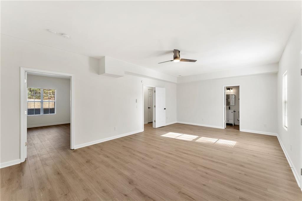 5805 Marbut Road Lithonia, GA 30058 - Photo 34 of 46 a view of empty room with wooden floor