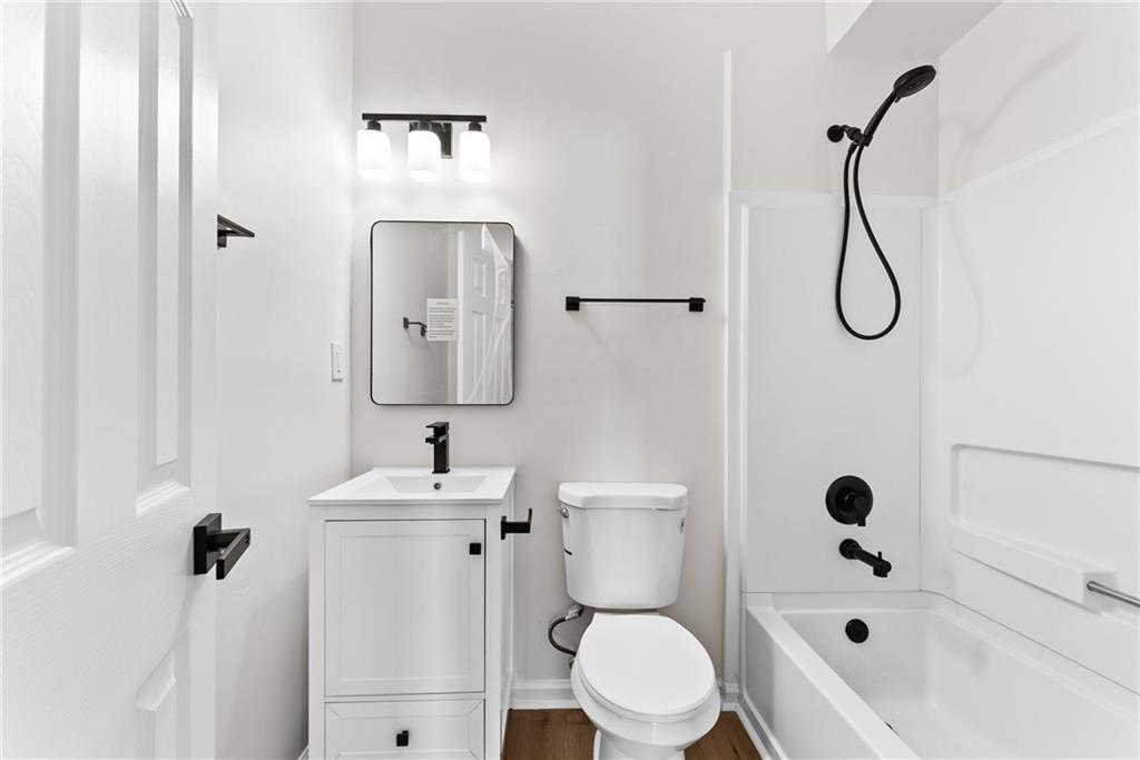 5805 Marbut Road Lithonia, GA 30058 - Photo 36 of 46 a bathroom with a sink toilet and shower