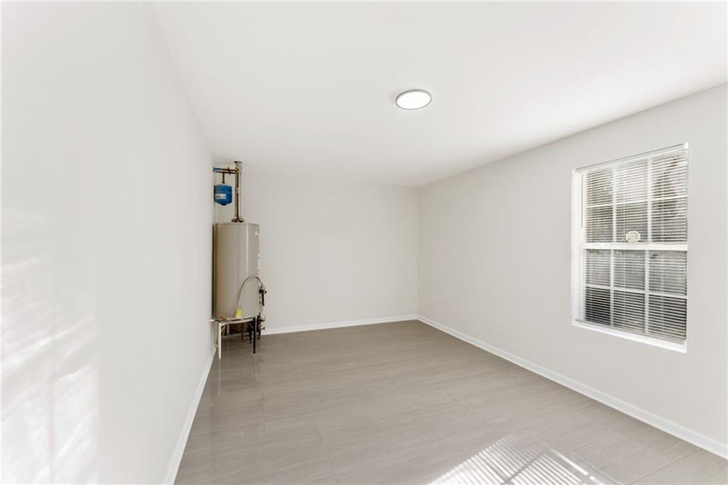 5805 Marbut Road Lithonia, GA 30058 - Photo 40 of 46 an empty room with a window