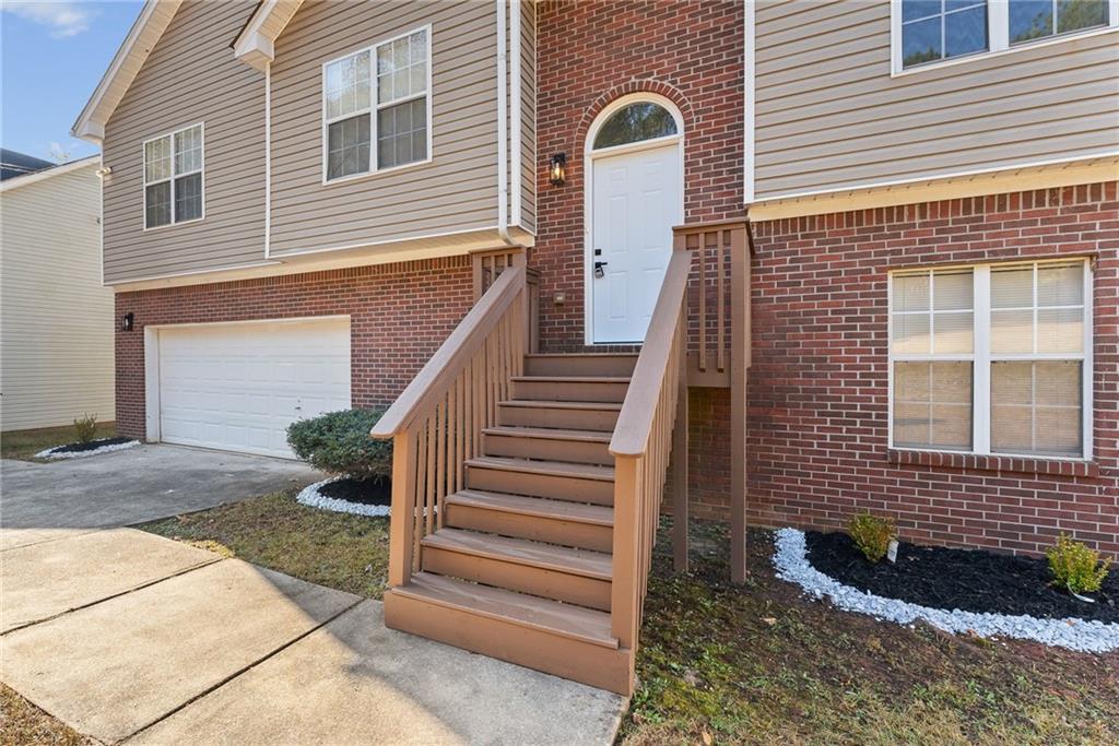 5805 Marbut Road Lithonia, GA 30058 - Photo 4 of 46 a view of a house with wooden fence and windows