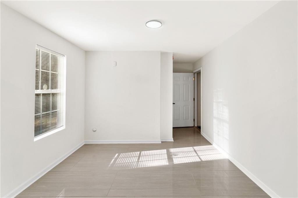5805 Marbut Road Lithonia, GA 30058 - Photo 42 of 46 a view of an empty room with a window