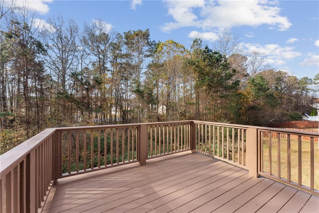5805 Marbut Road Lithonia, GA 30058 - Photo 43 of 46 a balcony with wooden floor and fence