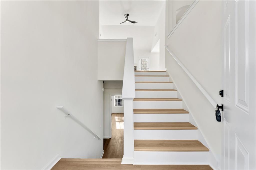5805 Marbut Road Lithonia, GA 30058 - Photo 5 of 46 a view of staircase with white walls