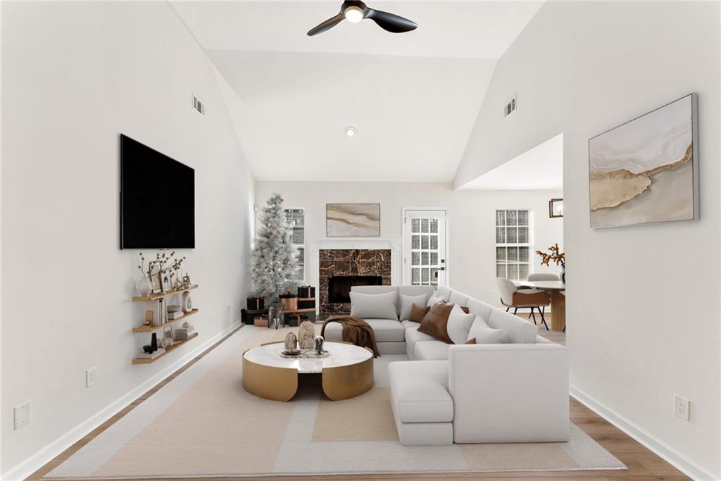 5805 Marbut Road Lithonia, GA 30058 - Photo 6 of 46 a living room with furniture and a fireplace