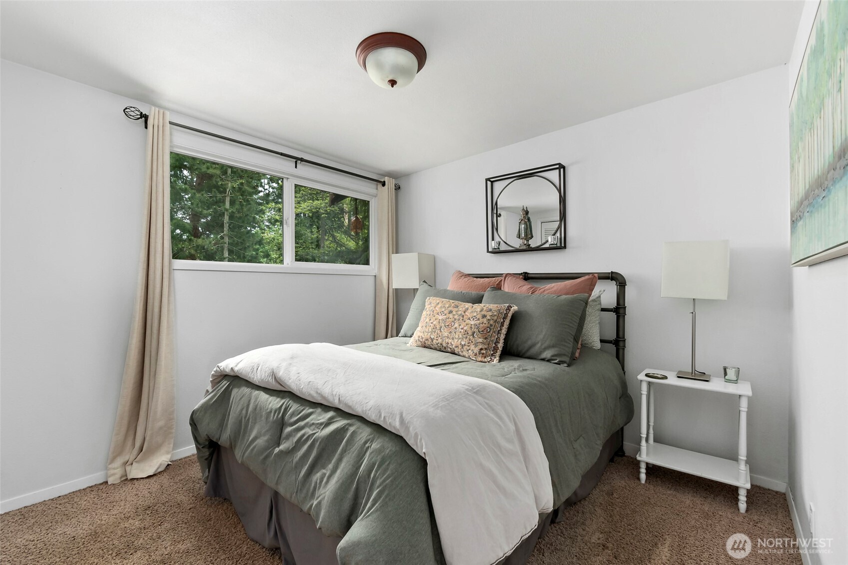 5222 East Harbor Road Freeland, WA 98249 - Photo 20 of 39 a bedroom with a bed and a window