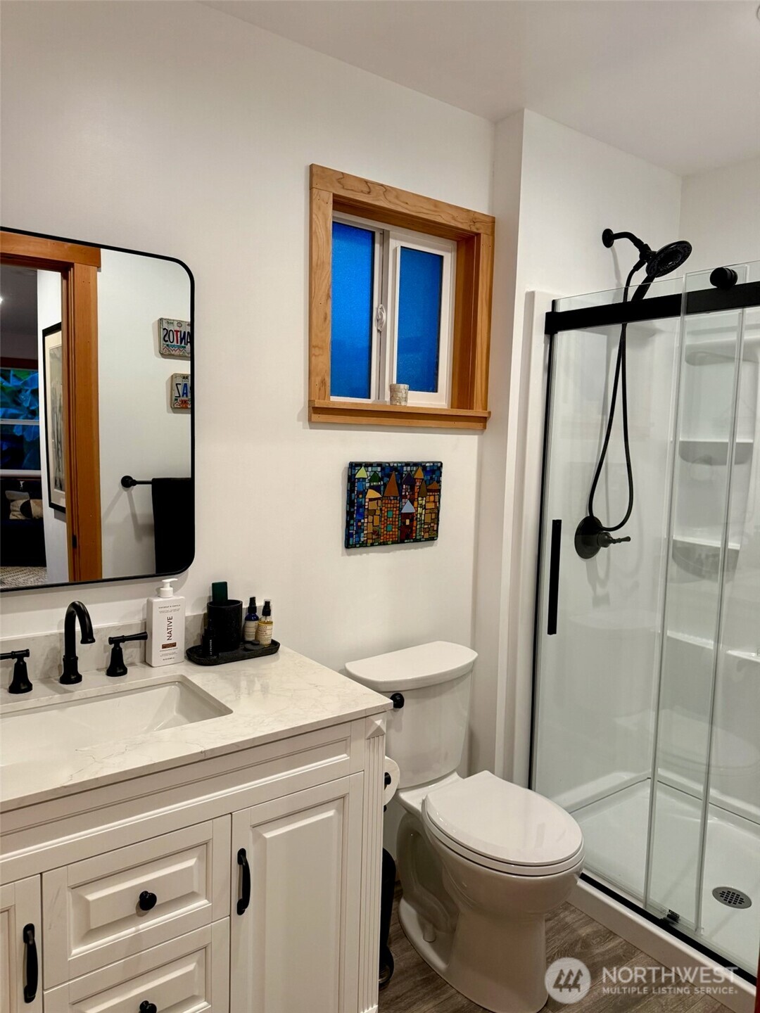 5222 East Harbor Road Freeland, WA 98249 - Photo 27 of 39 a bathroom with a sink toilet and shower