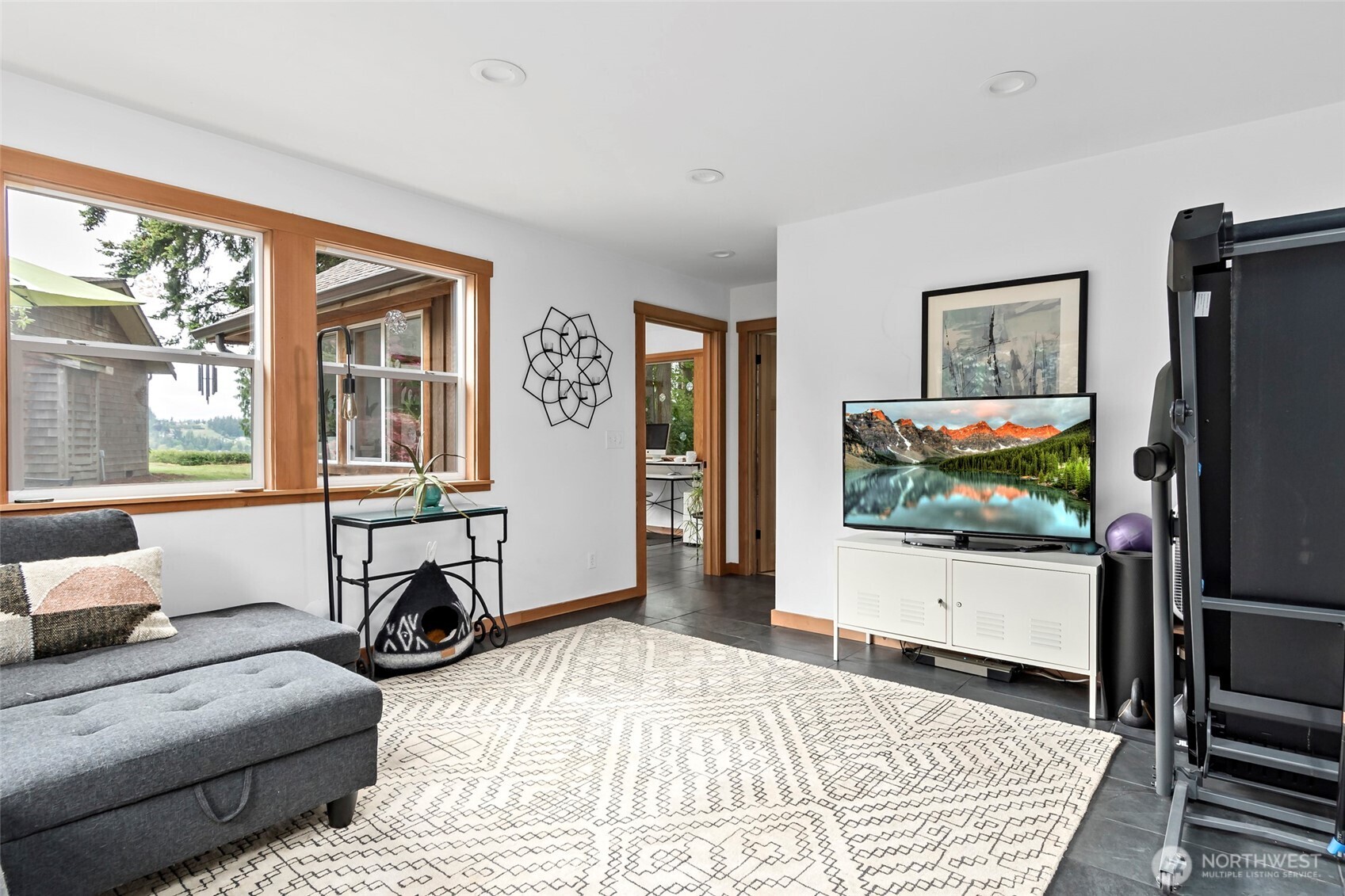 5222 East Harbor Road Freeland, WA 98249 - Photo 28 of 39 a living room with furniture and a flat screen tv