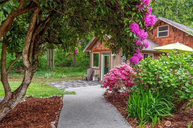 a front view of a house with yard