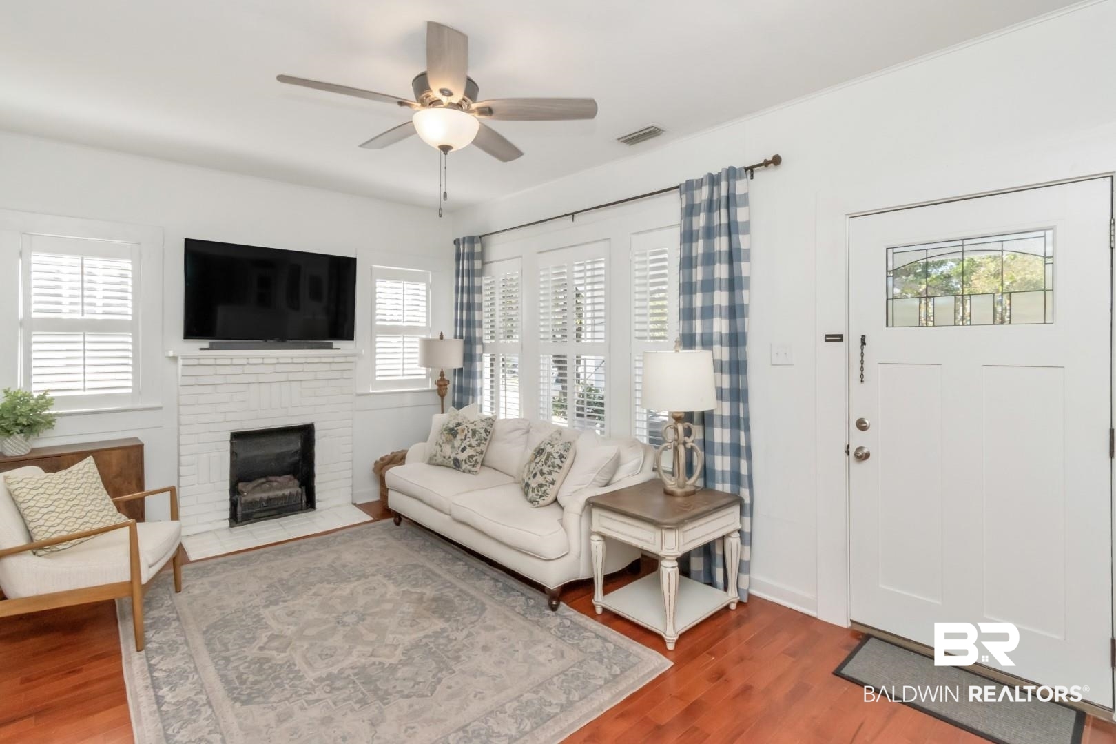 116 Item Avenue Mobile, AL 36607 - Photo 7 of 33 Living room with a fireplace, wood-type flooring, and ceiling fan
