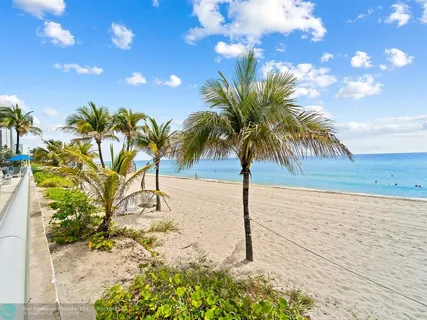 a view of swimming pool with outdoor seating