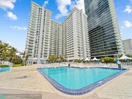 a view of a hall with white walls