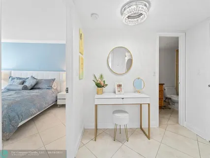 a bedroom with a bed and a table