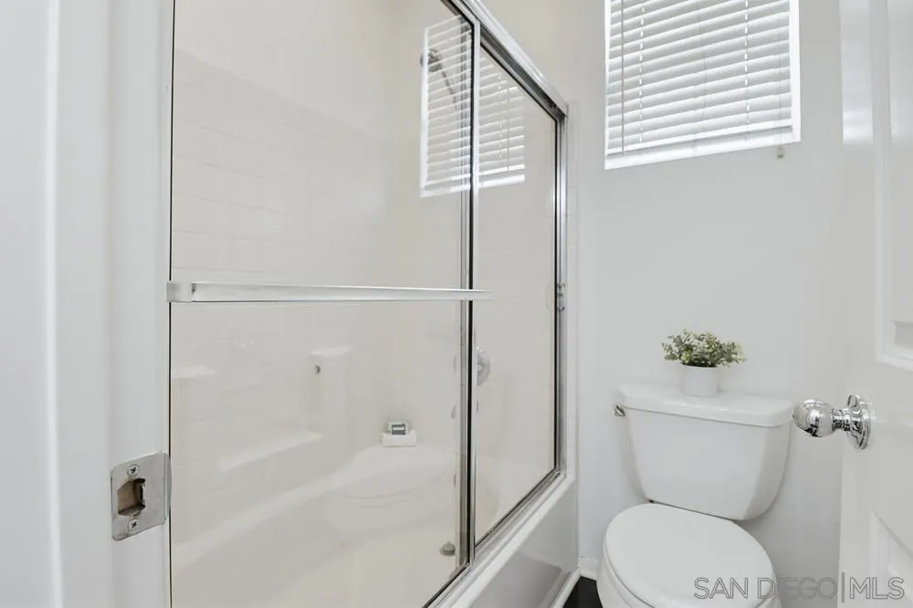 1293 Fools Gold Way, Unit 3 Chula Vista, CA 91913 - Photo 17 of 28 a bathroom with a toilet and a shower